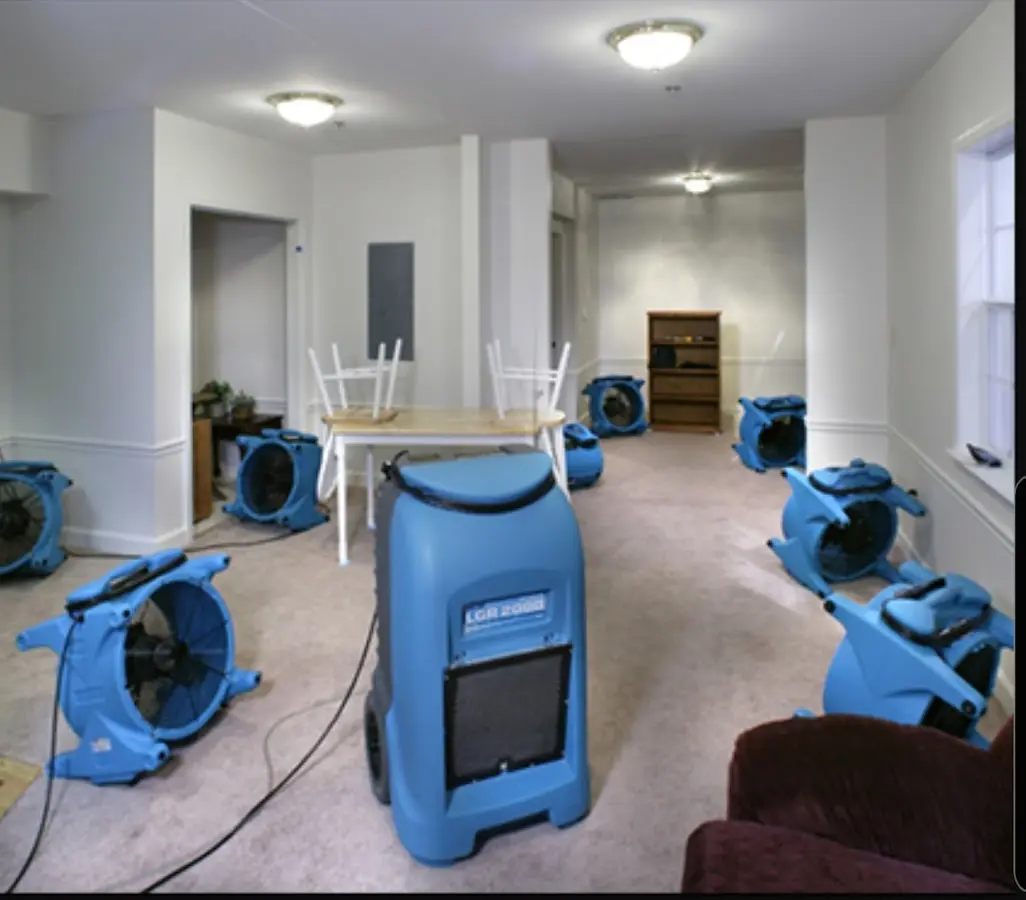 Air movers and dehumidifier setup for Water Damage Restoration in Metropolis